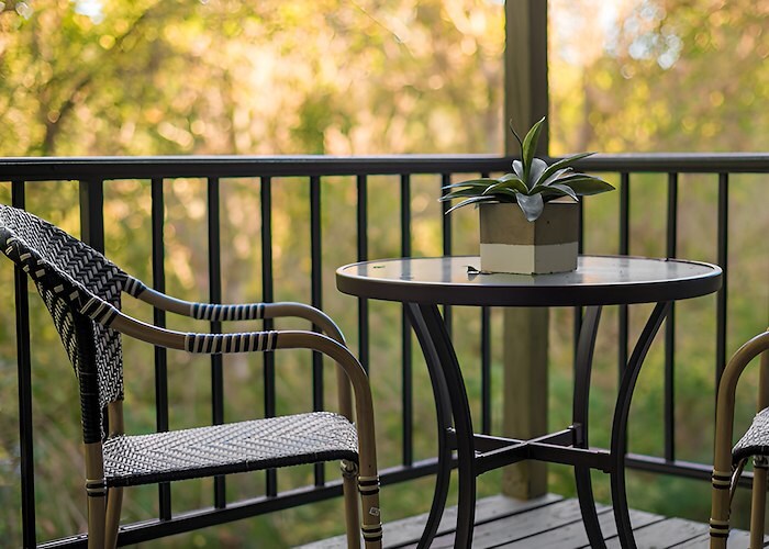 A table and chairs on a balcony, Roxalana Apartments, Dunbar, West Virginia