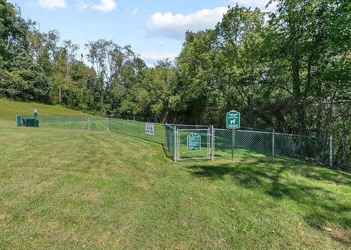 A fenced in area with a sign that says "dog park", Roxalana Apartments, Dunbar, West Virginia
