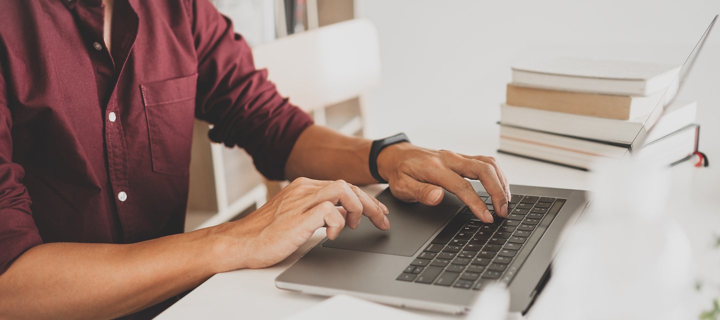 A person typing on a computer
