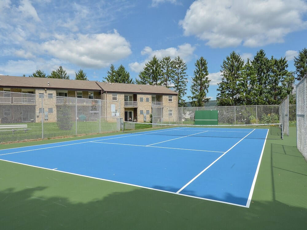 Full-sized tennis and pickleball court at Springetts Apartments, just one of the many amenities available for residents to enjoy.