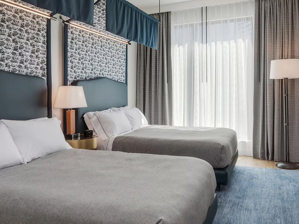 Guest room with two beds at Canopy by Hilton Boston Downtown, MA.