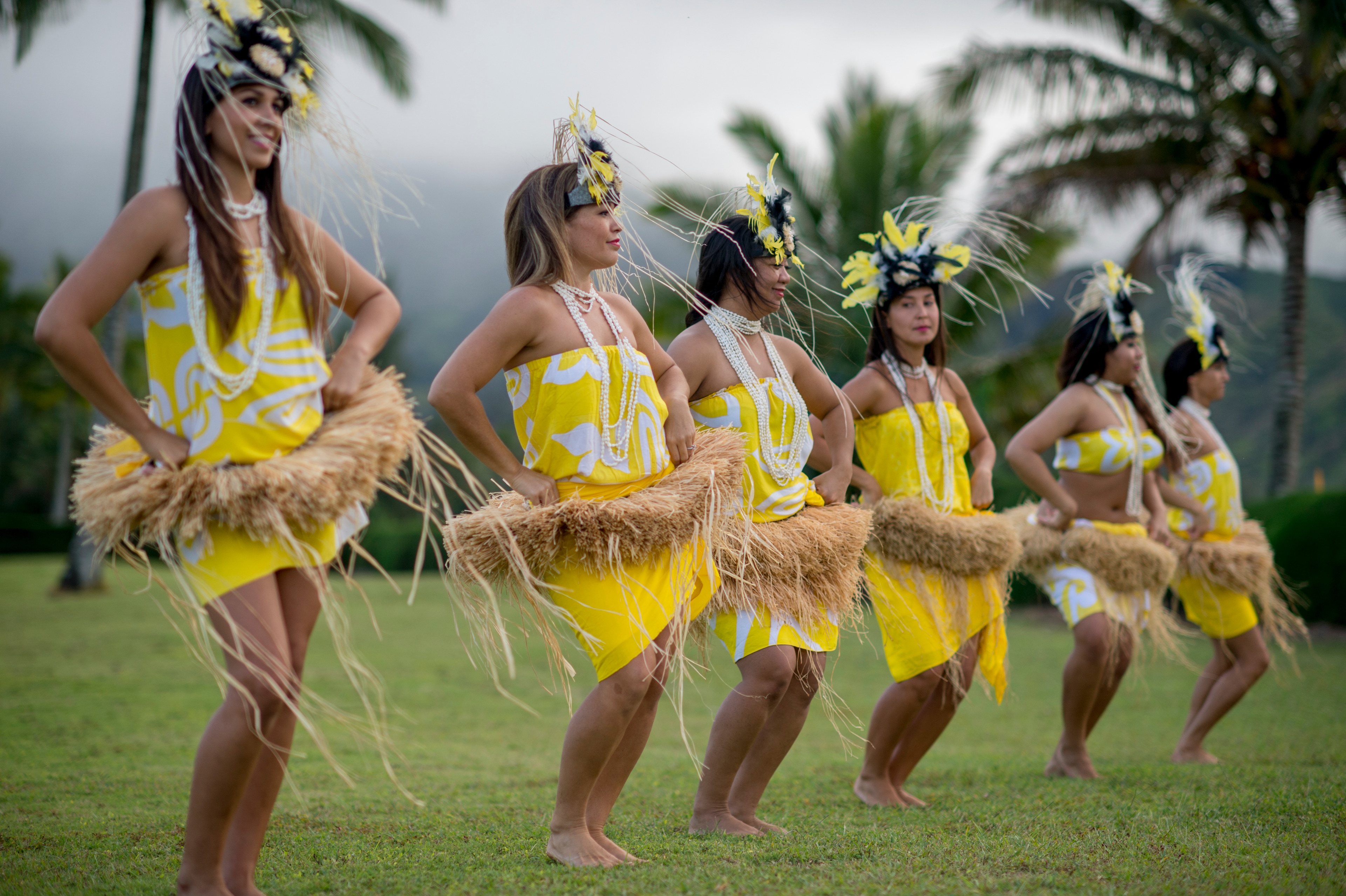 Hula dancers perform in traditional attire at Embassy Suites by Hilton Waikiki