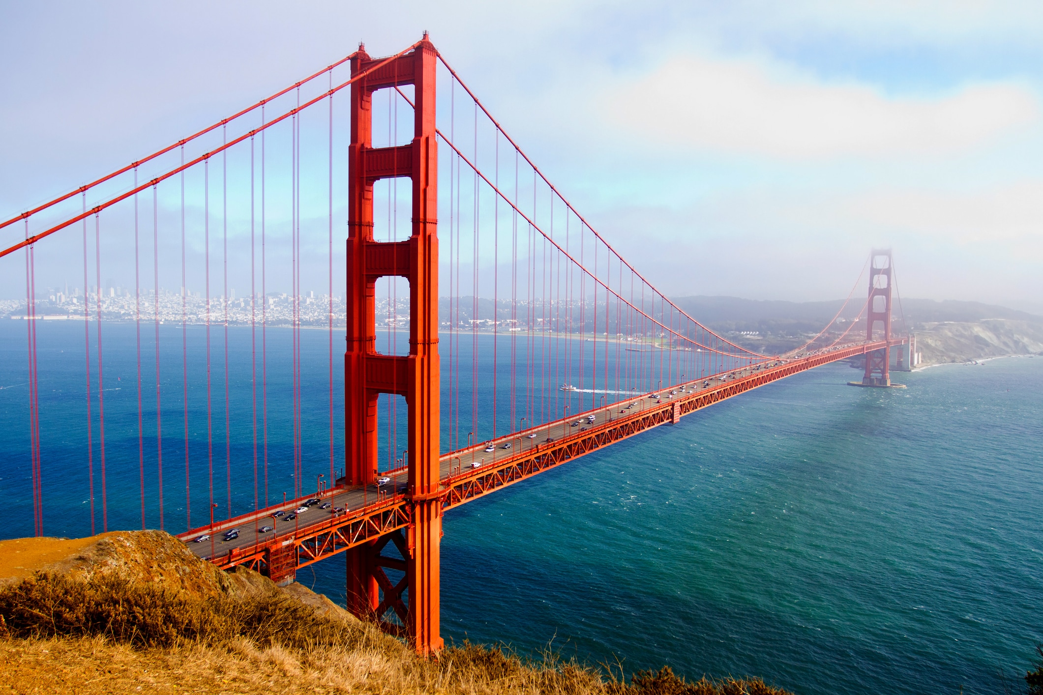 A wide view of the Golden Gate Bridge and the San Francisco Bay.