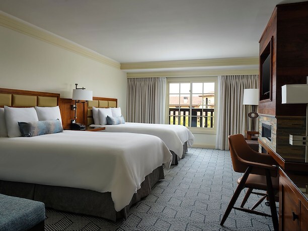 Relax in a spacious guest room featuring two comfortable beds.