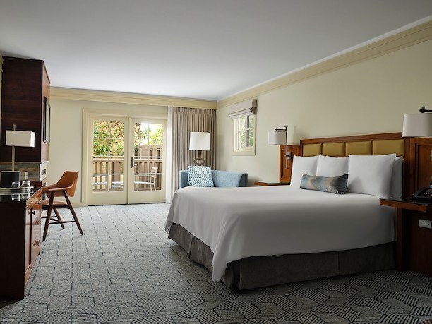 hotel guest room with bed and patio