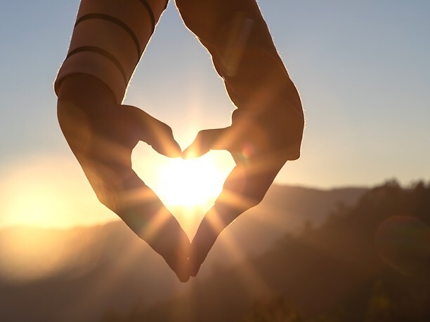 couple making hand heart
