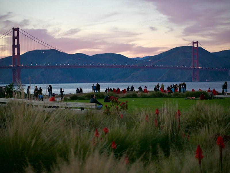 Crowds Gather at the Presidio to Watch Sunset Over the Golden Gate Bridge