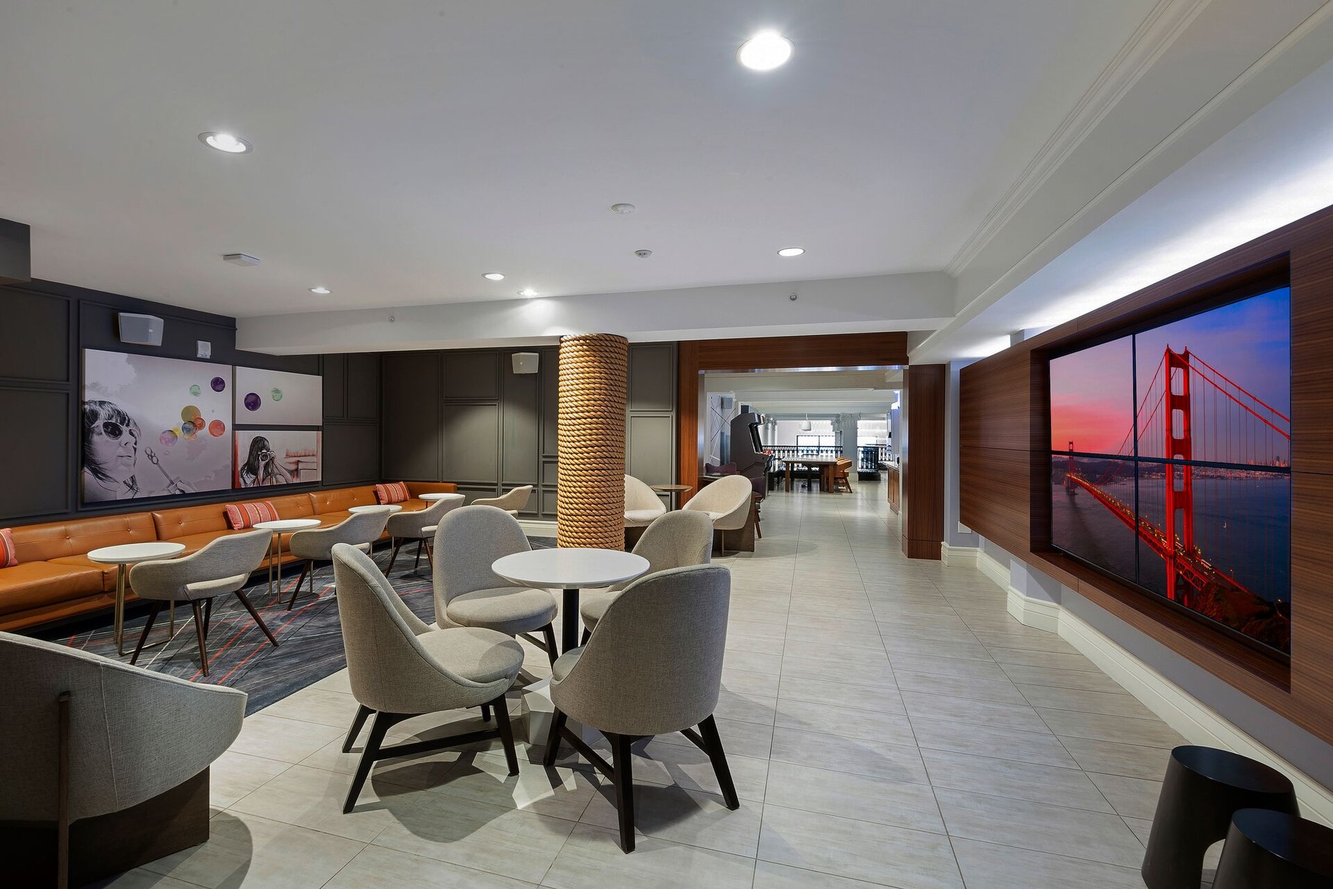 Interior hallway with geometric carpet and modern light fixtures at The Axiom Hotel, San Francisco.