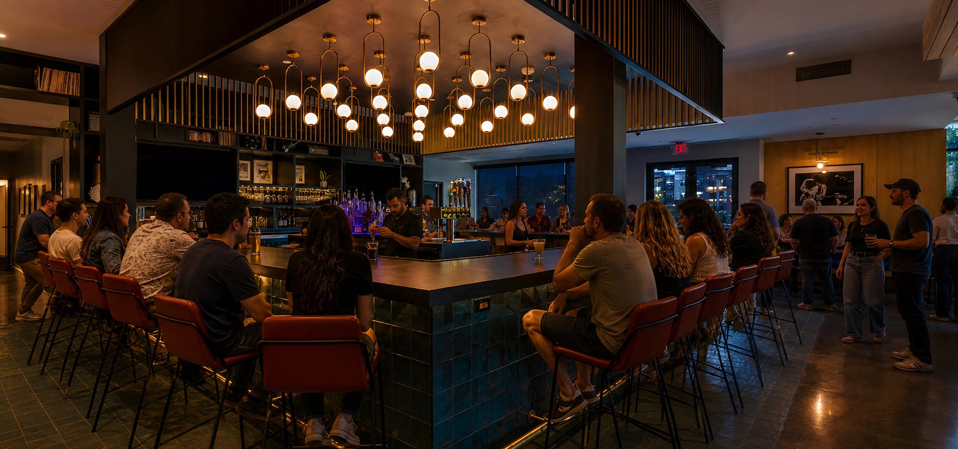 Guests enjoy drinks at the bar inside Backstage Bar & Grill in Austin, TX.