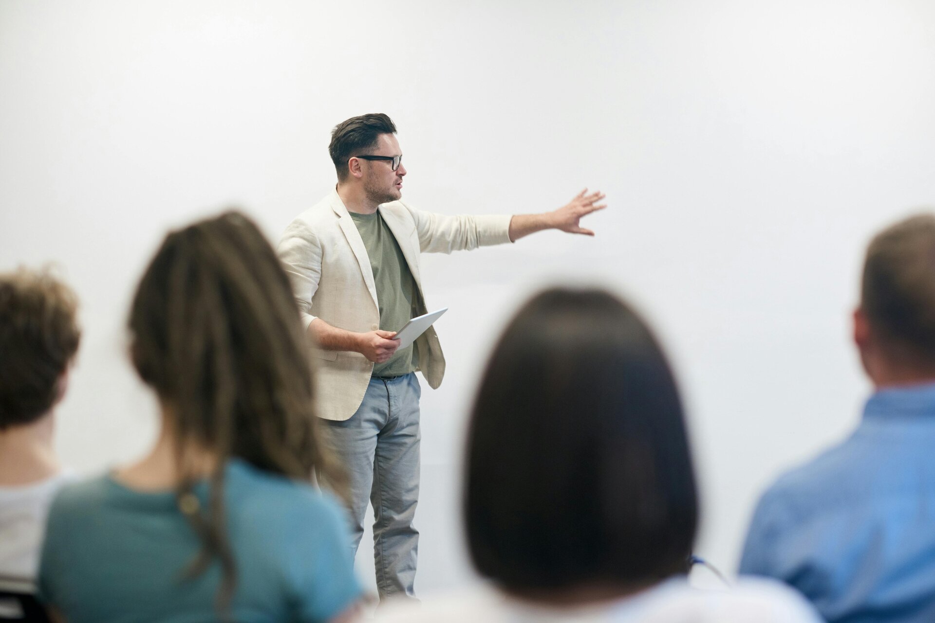 man presenting to crowd of people