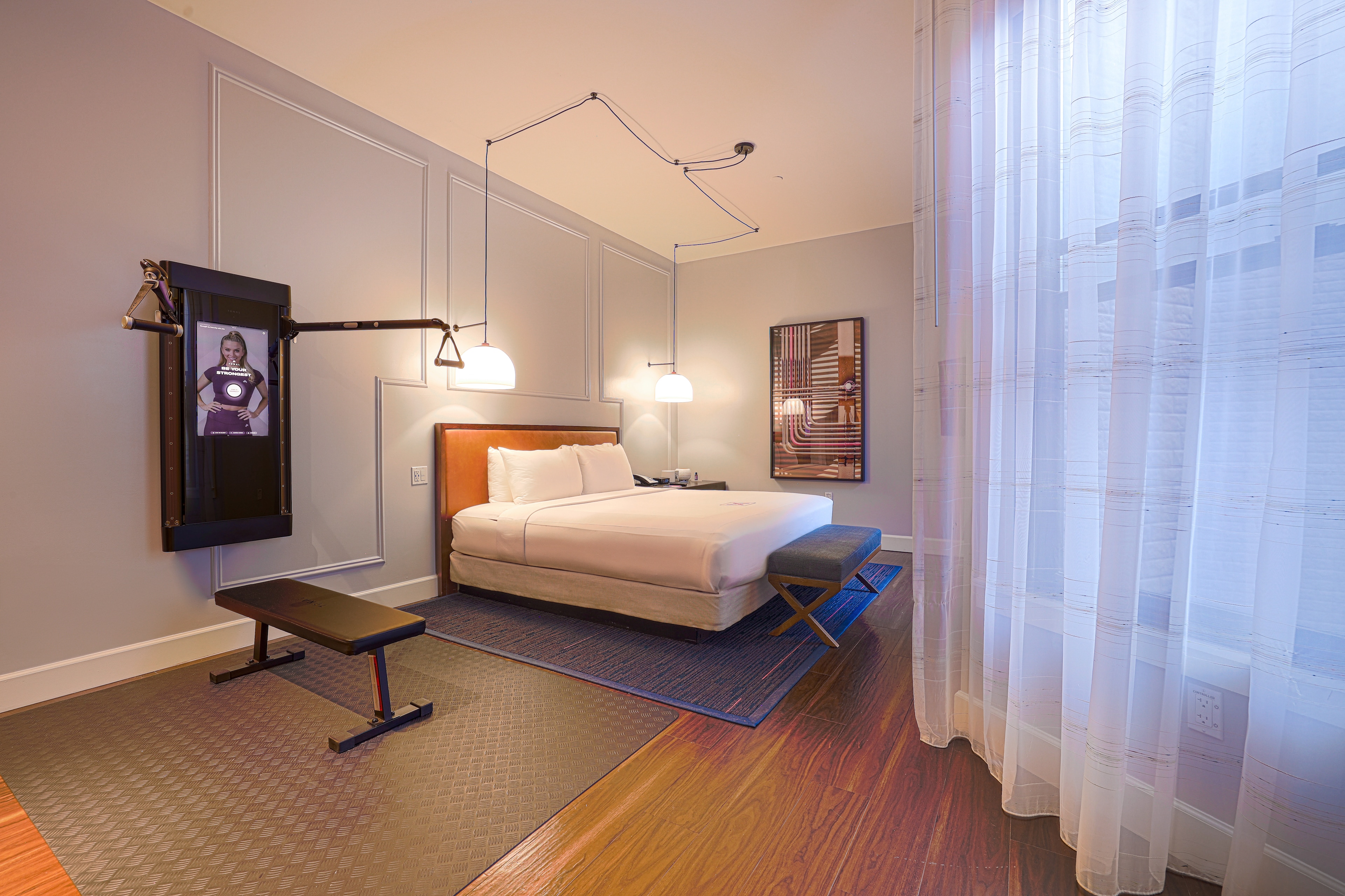 A modern room featuring workout equipment at The Axiom Hotel, San Francisco.