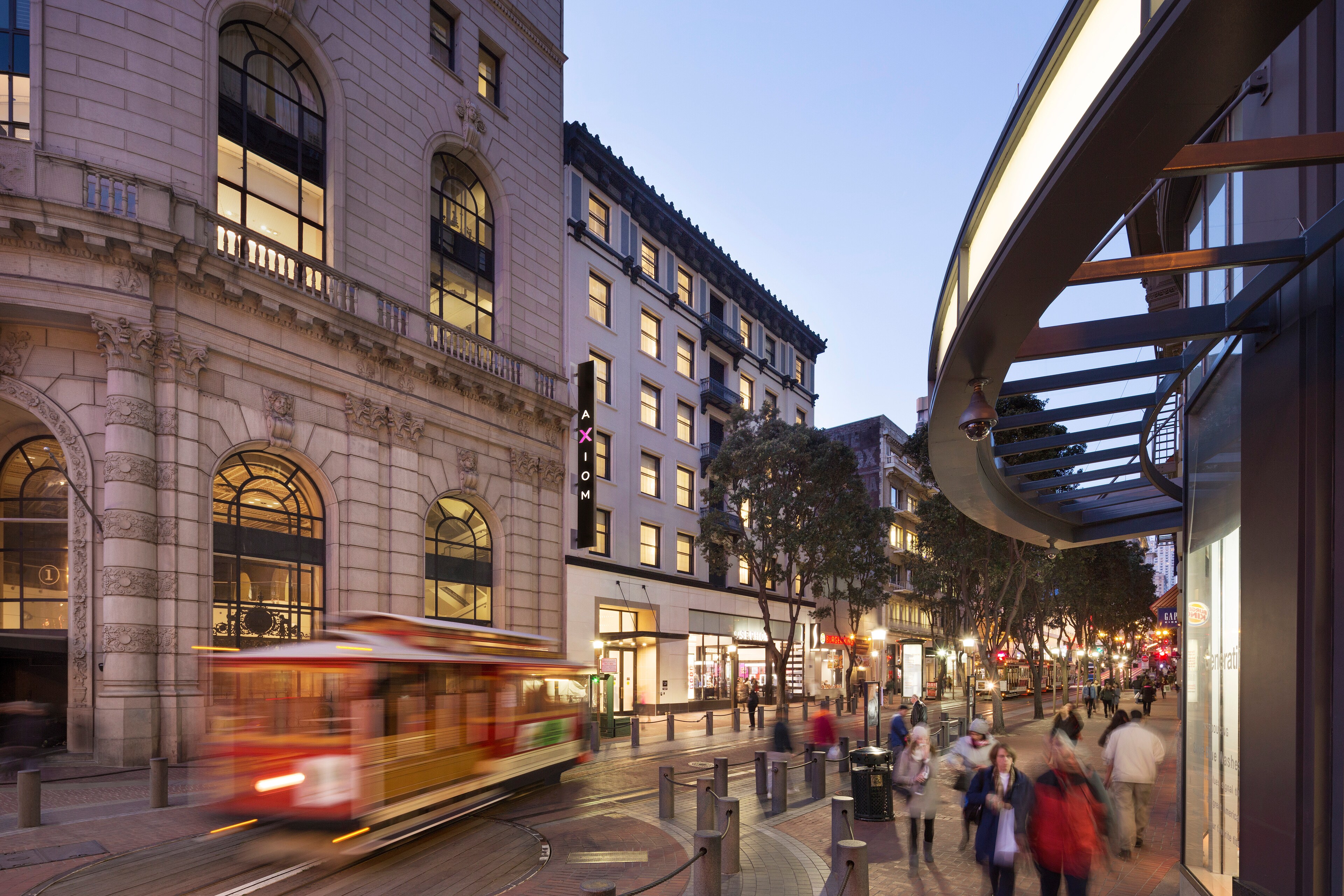 The Axiom Hotel is located in a vibrant street scene in San Francisco.