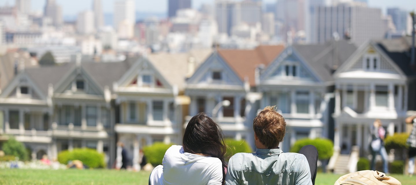 couple laying on the grass