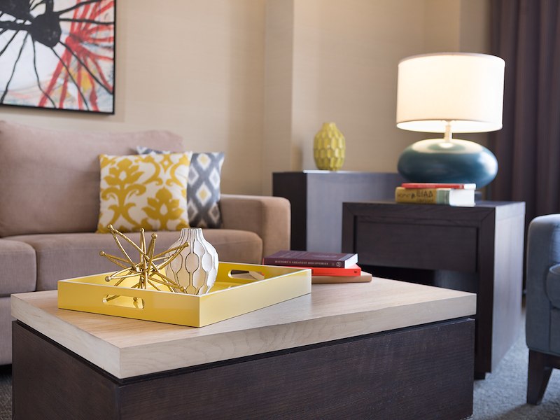 A table with a yellow tray on it