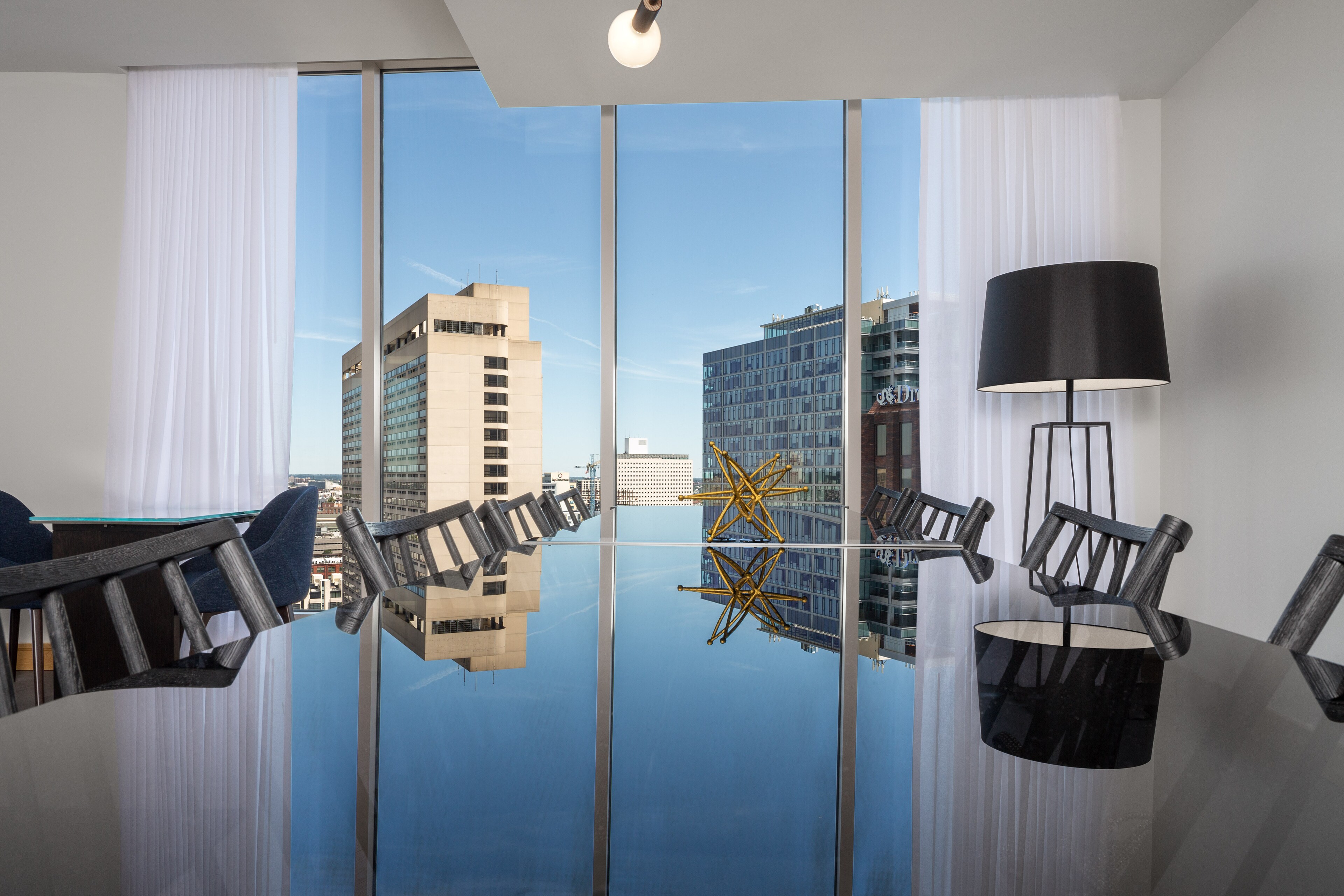 A stylish meeting space with city views at The Windsor Suites in Philadelphia.