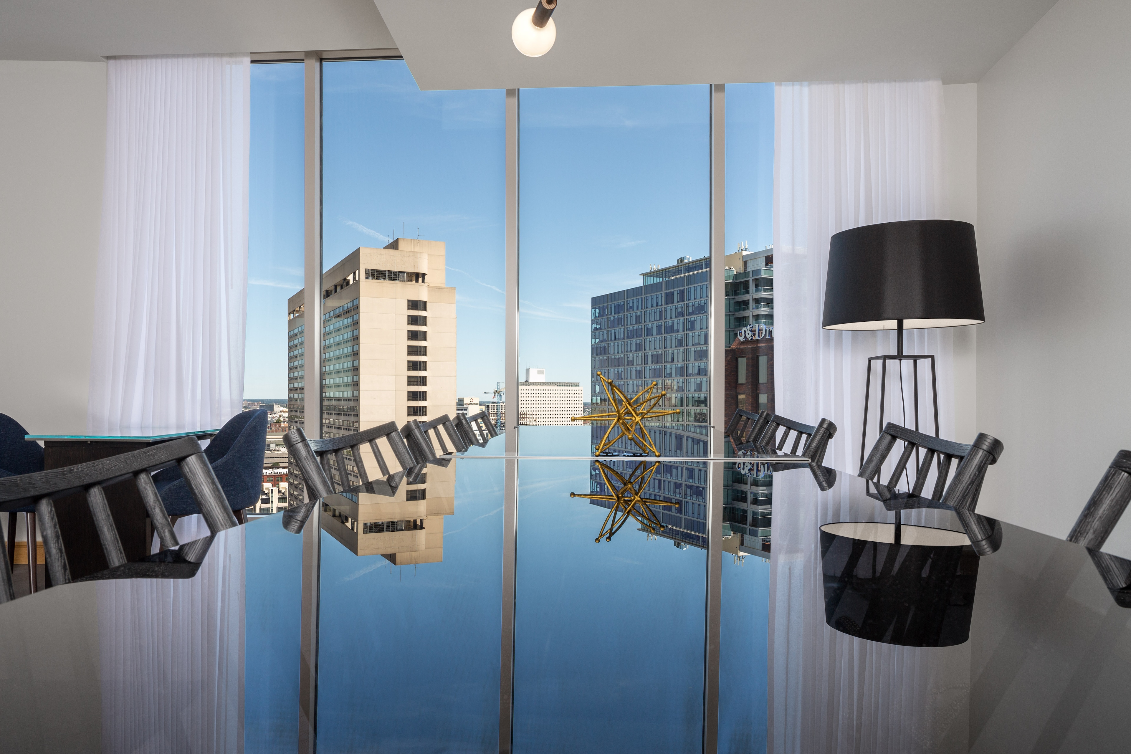 A stylish meeting space with city views at The Windsor Suites in Philadelphia.