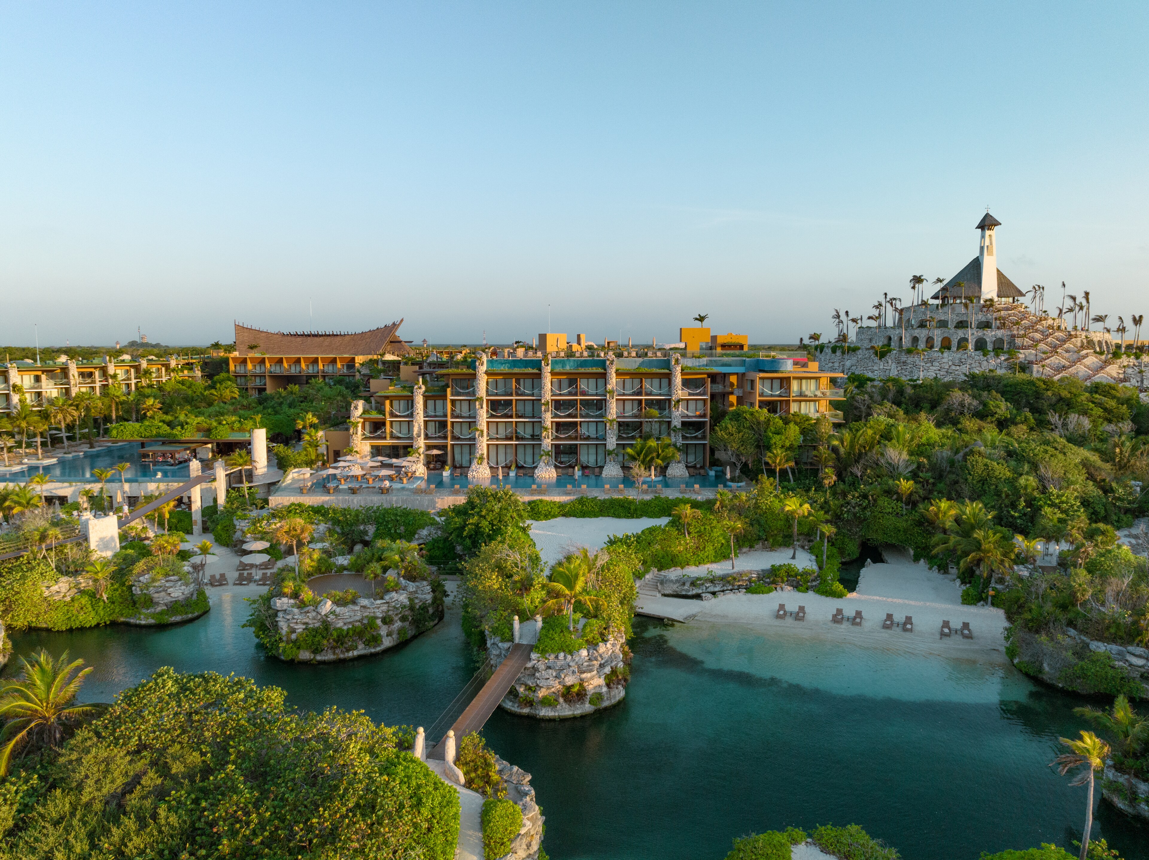 <p>At Hotel Xcaret Mexico, waterways flow throughout the property to replicate the Yucatan Peninsula's sacred cenotes.</p>