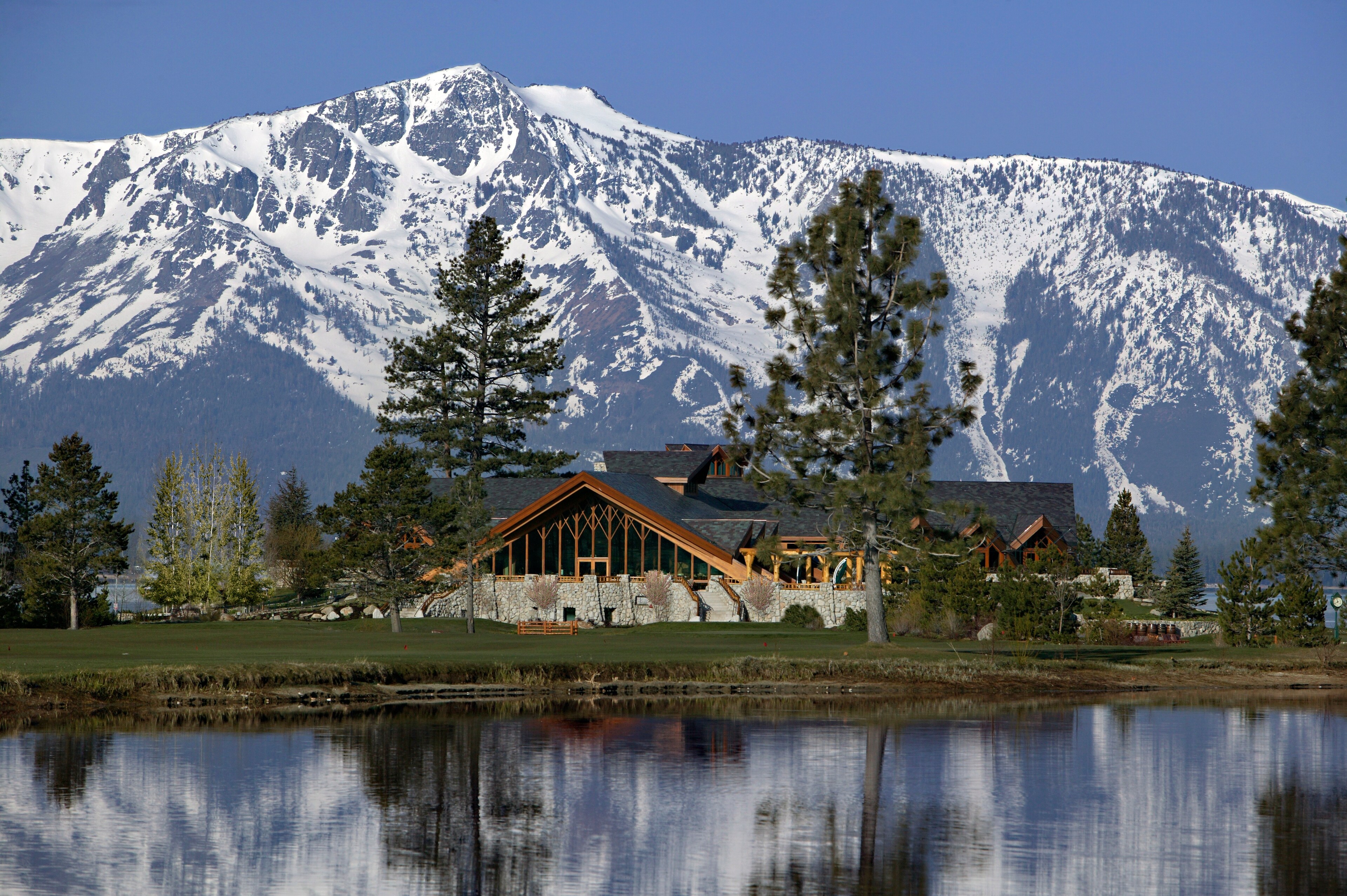Resort Building with Snow-Covered Mountains in Background