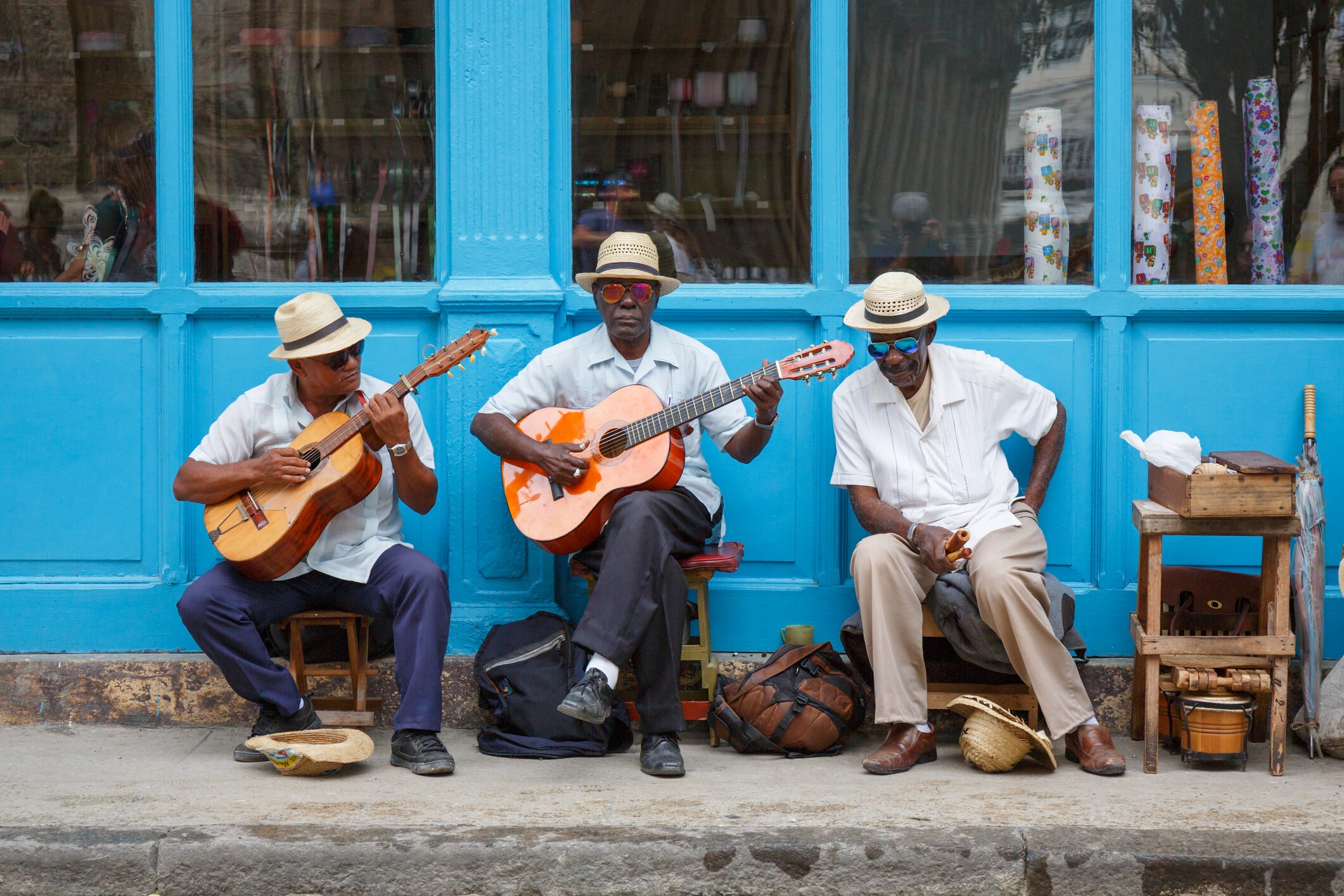 <p>Local musicians perform along Havana's brightly colored façades.</p>