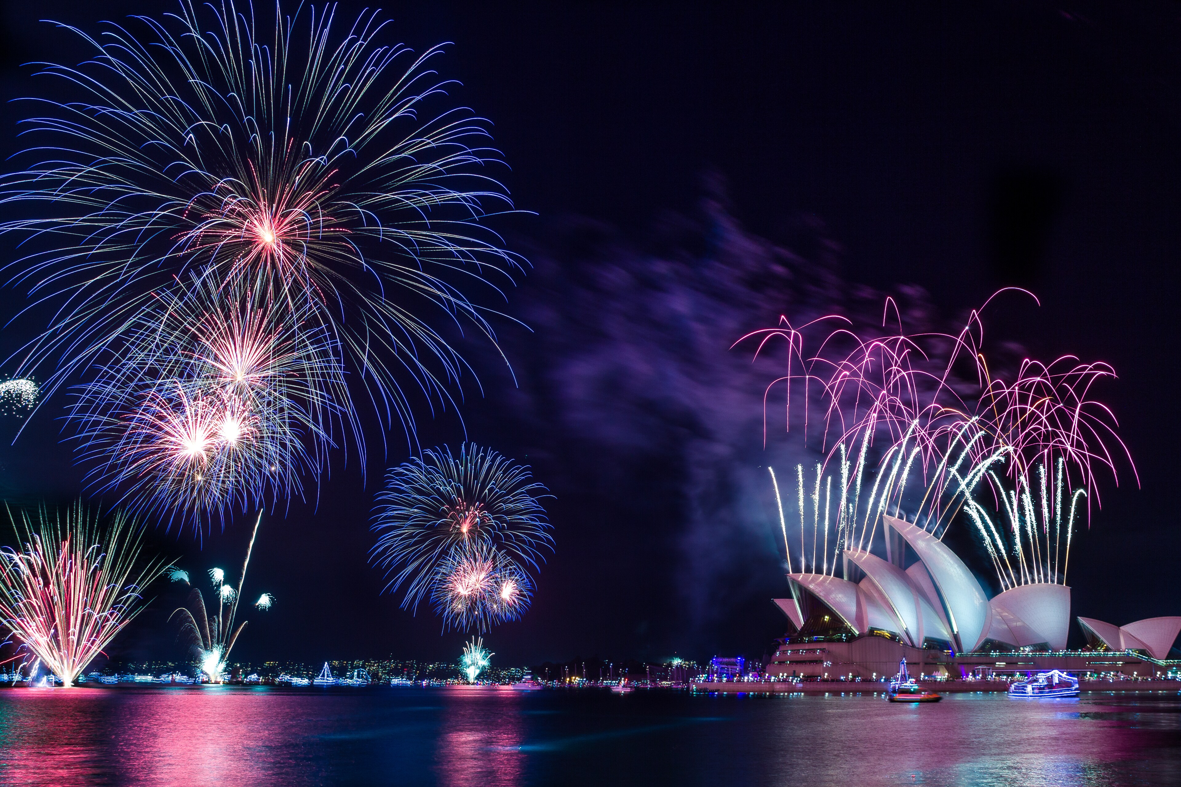 Fireworks light up Sydney Harbor and the iconic Sydney Opera House.