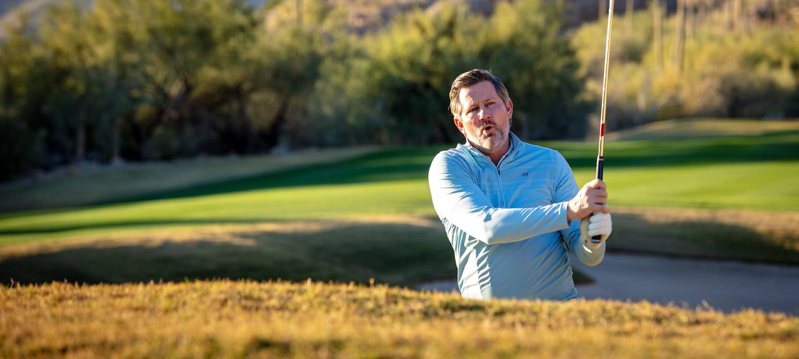 The author taking a bunker shot at Ventana Canyon's Mountain Course