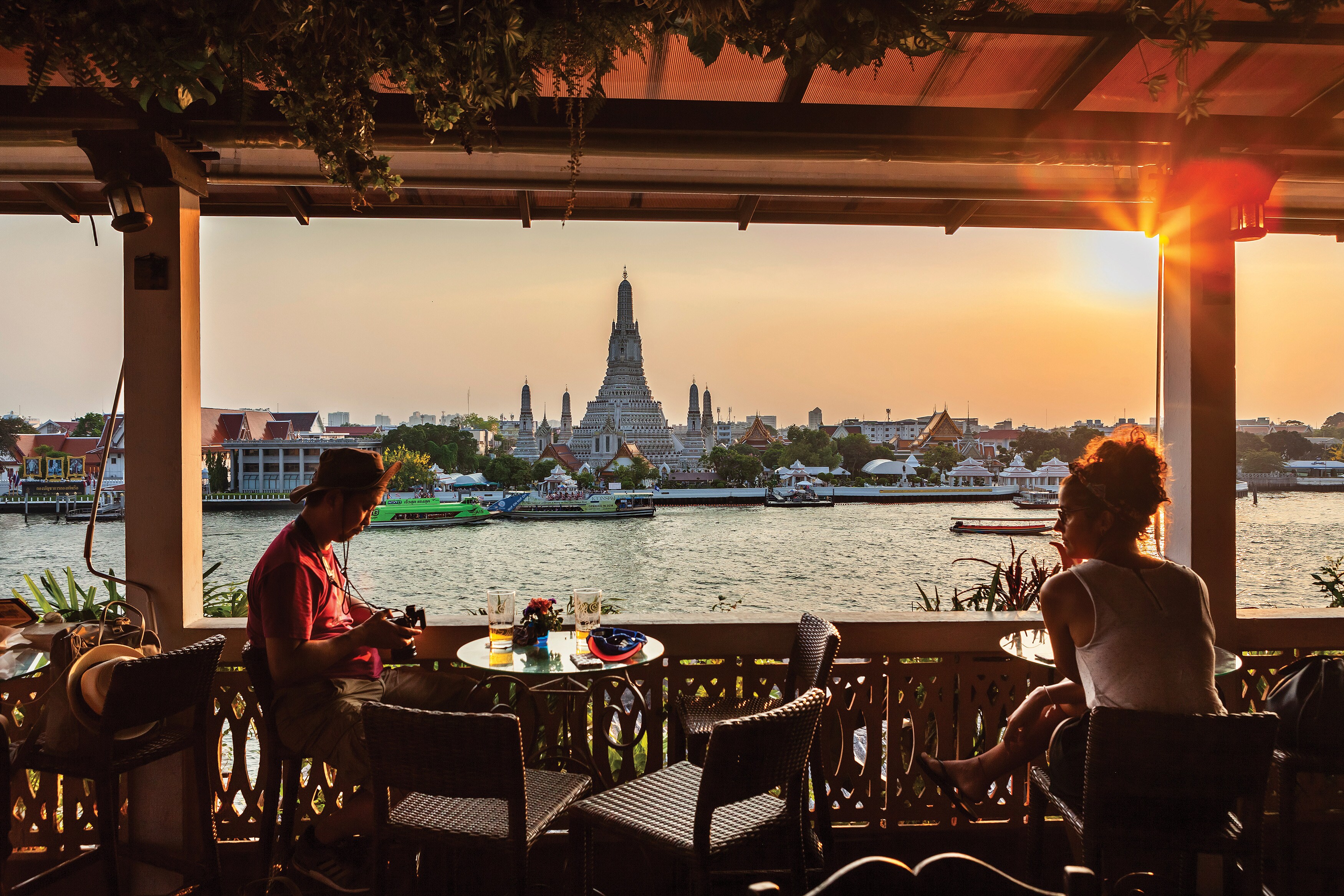 A view of Wat Arun temple from a dining spot across Chao Phraya River.