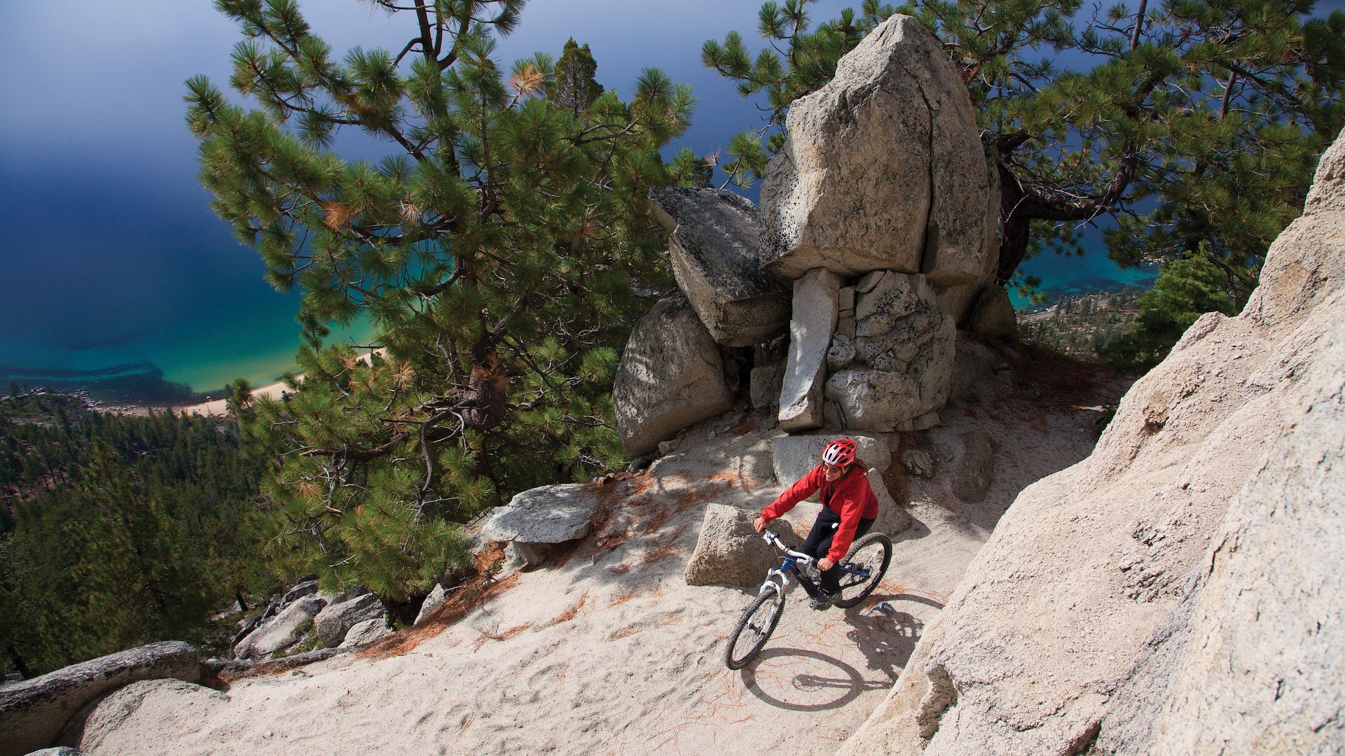 A mountain biker rides along the Flume Trail high above Lake Tahoe.