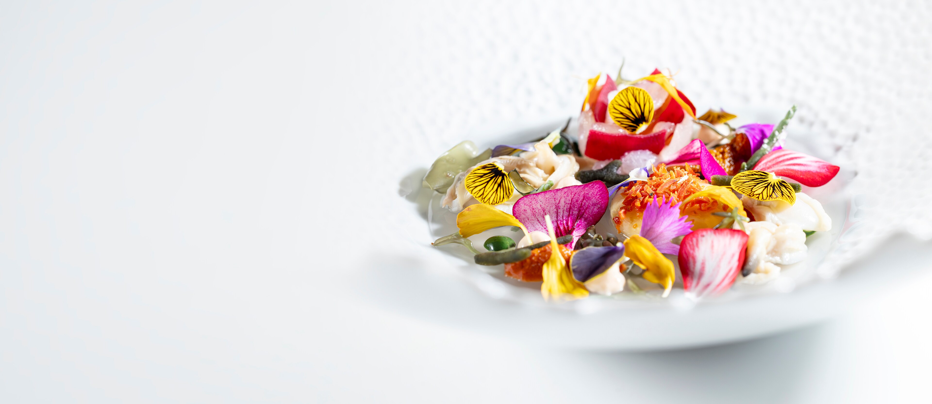 An Ensalada at Lesarte exemplifies the restaurant's refined gastronomic excellence.