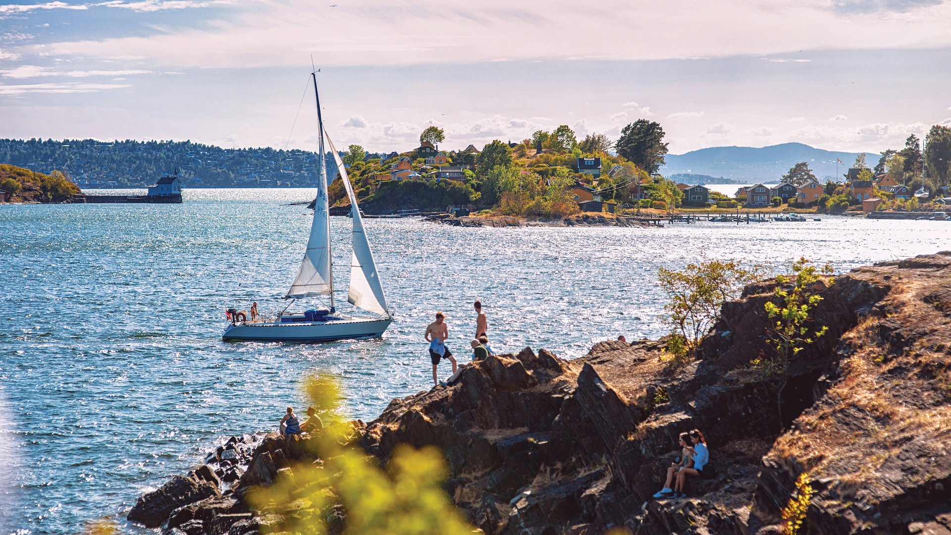 Locals enjoying recreational water activities in the Oslofjord during summer.