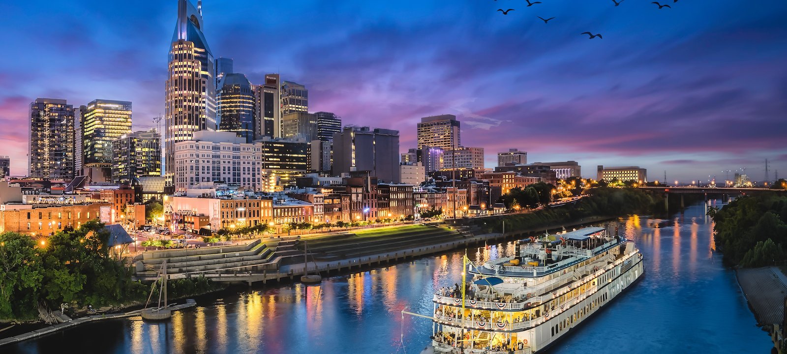 An evening cruise on the Cumberland River passes downtown Nashville.