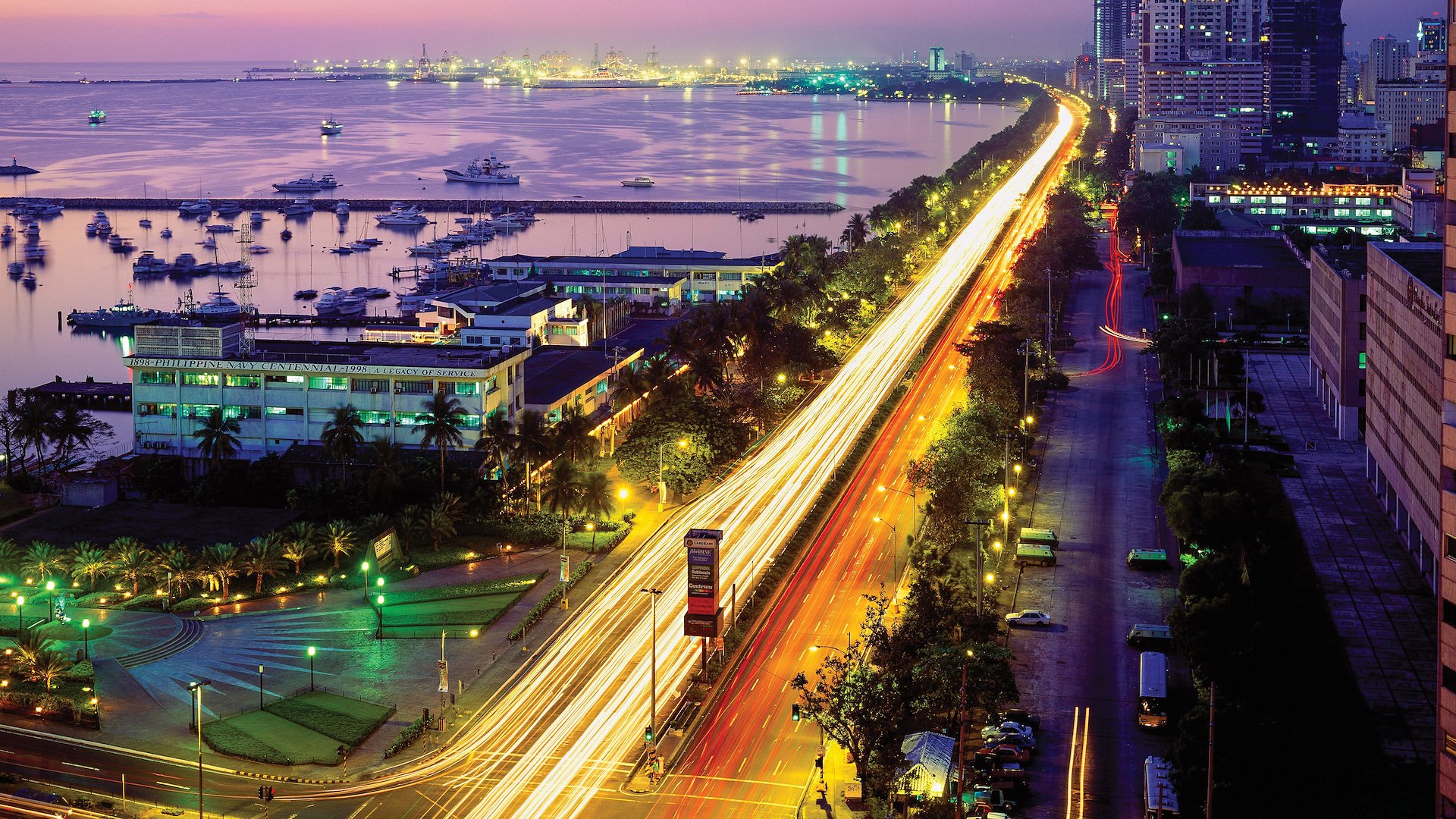 Popular waterfront promenade Roxas Boulevard stretches along the shores of Manila Bay.