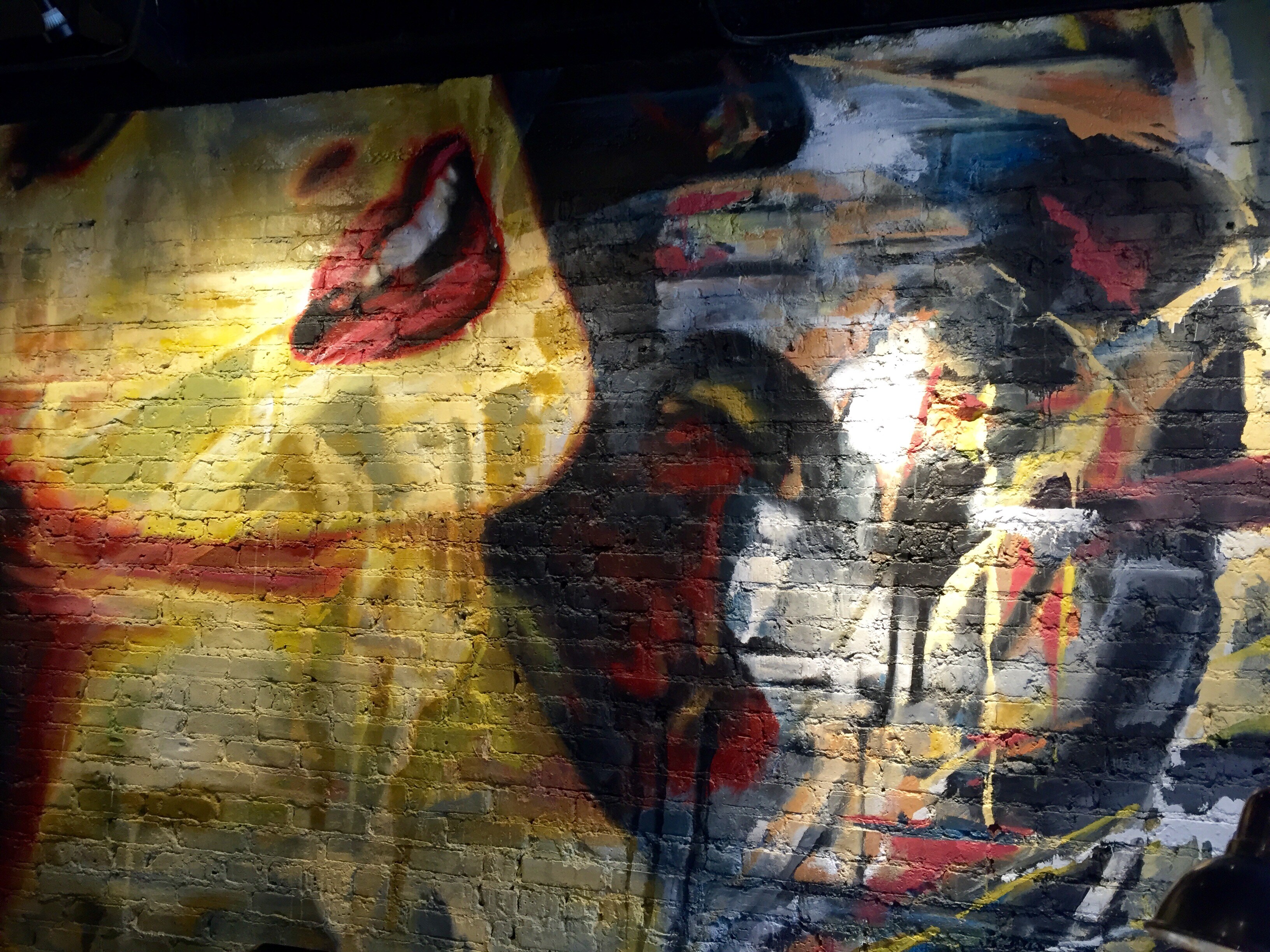 Colorful mural art on a brick wall at ACME Hotel in Chicago, Illinois.
