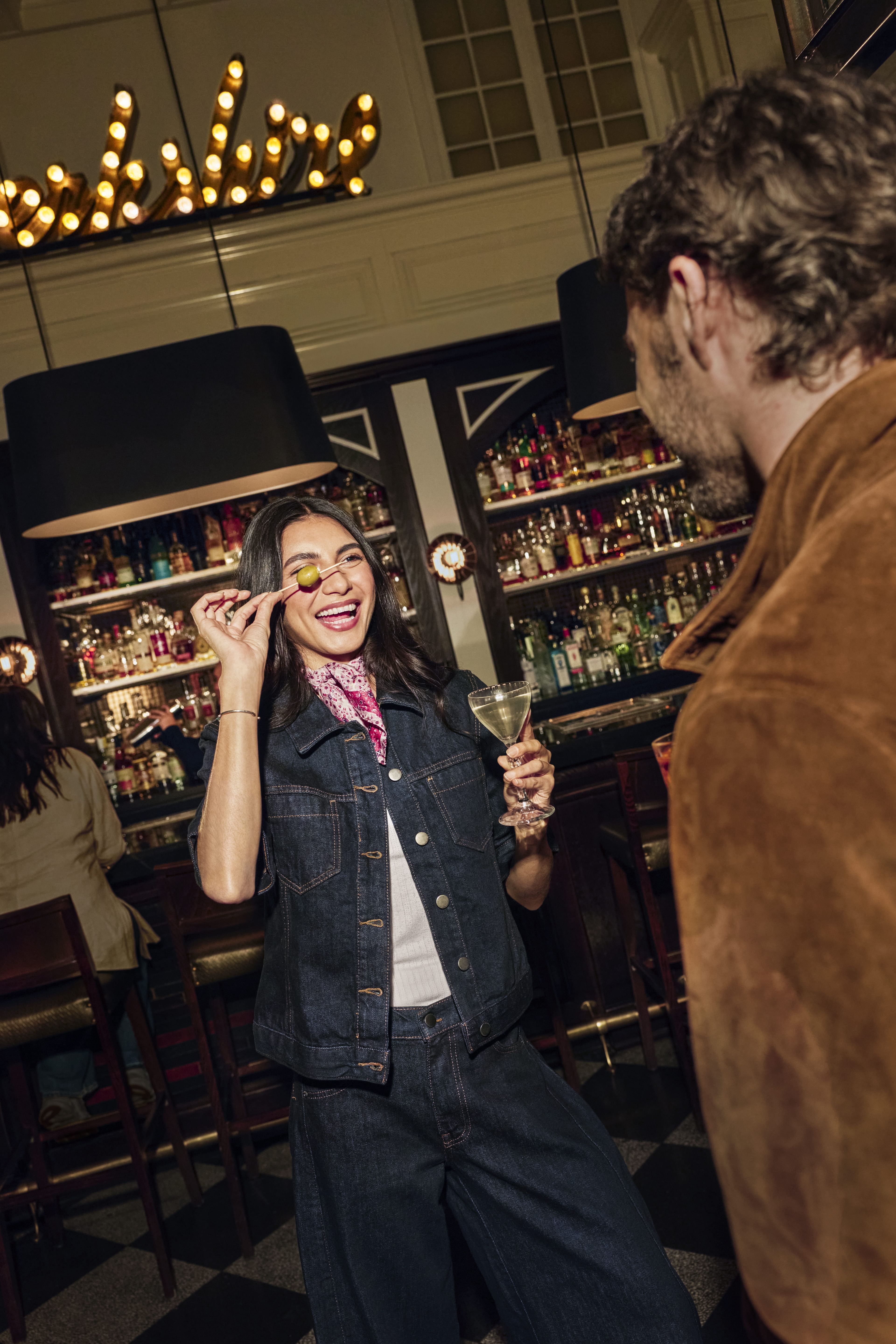 A guest enjoys a cocktail at the ACME Hotel bar in Chicago, Illinois.