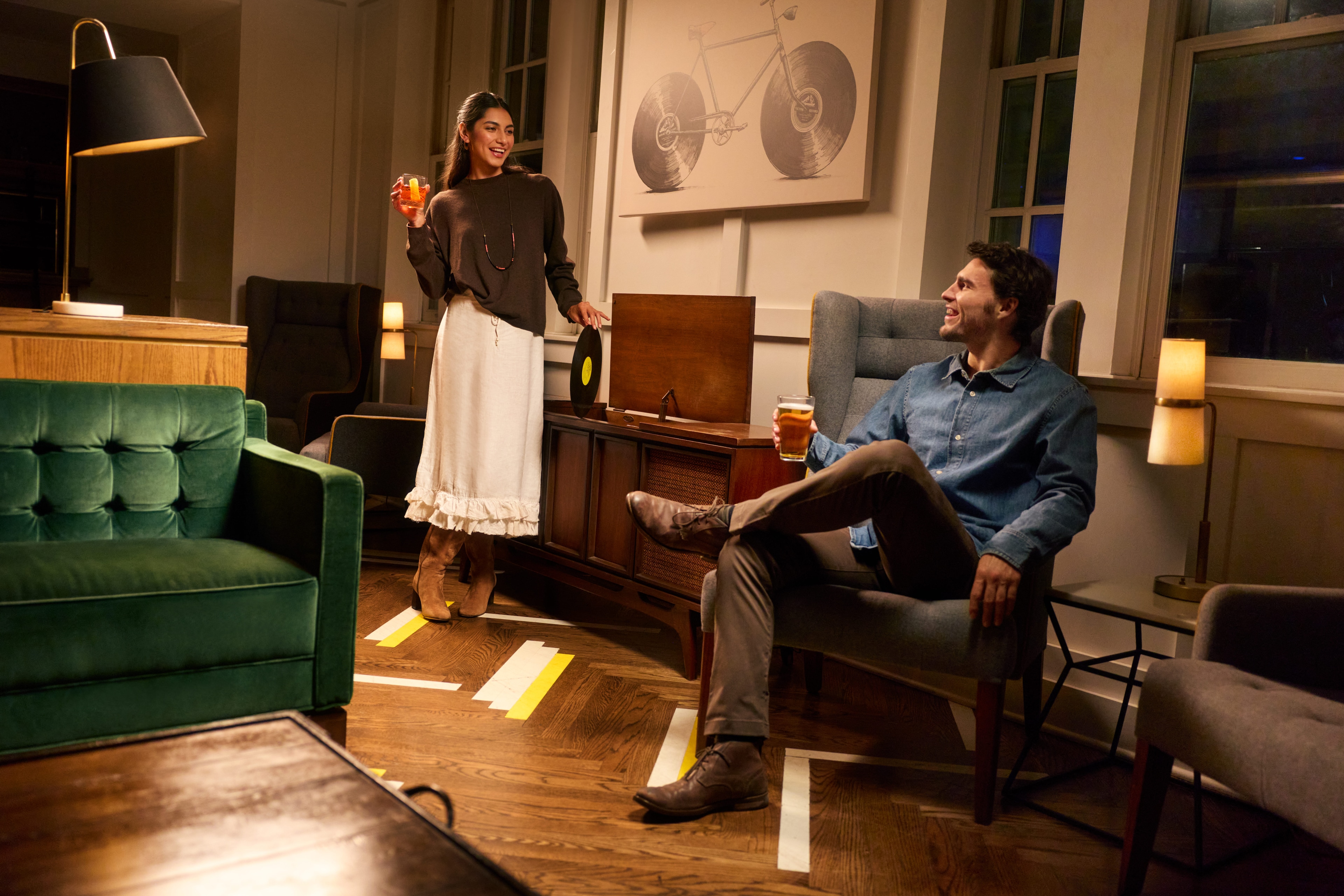 Guests enjoy drinks in the cozy lounge at ACME Hotel in Chicago, Illinois.