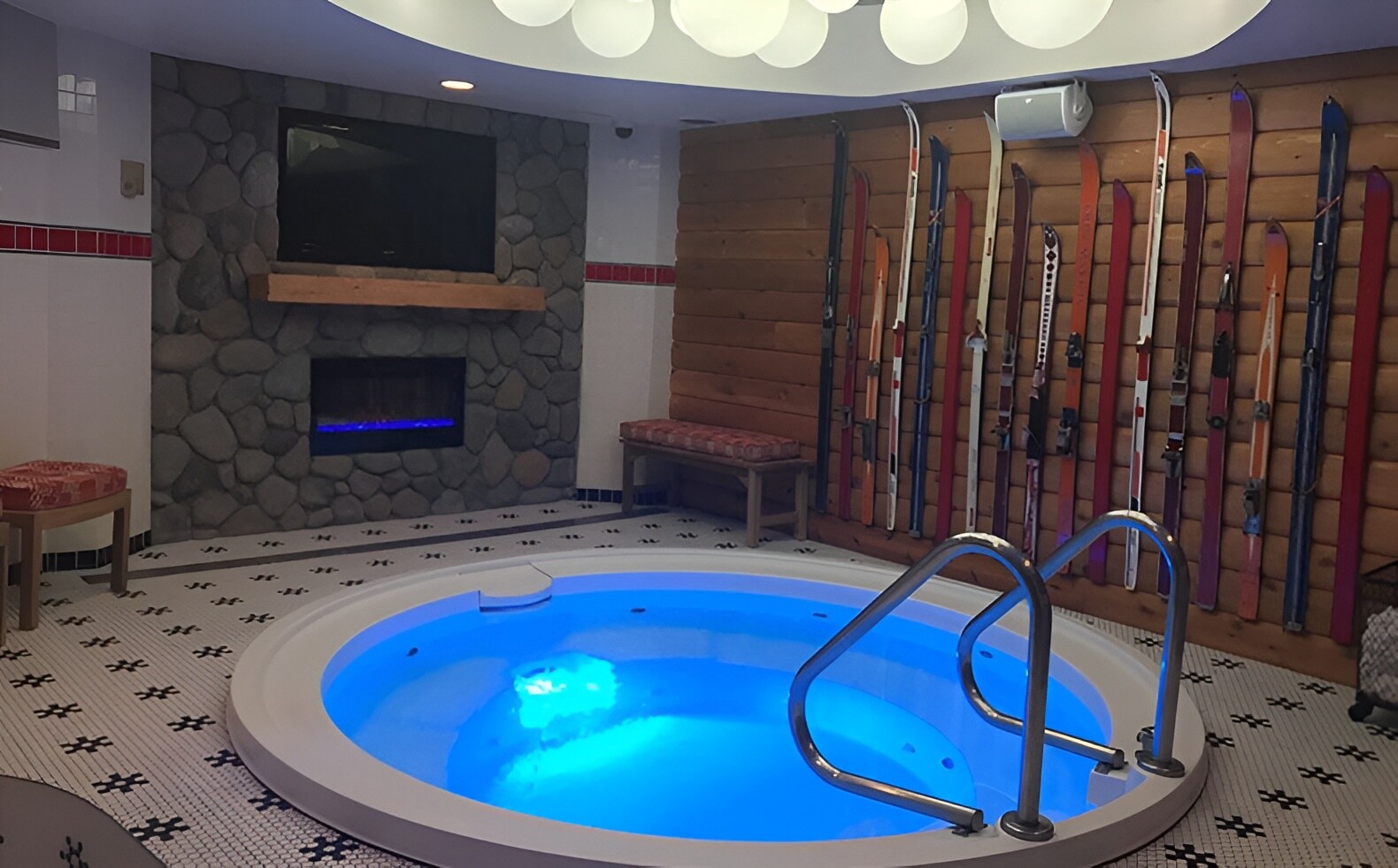The ACME Hotel features a relaxing hot tub area with ski decor.