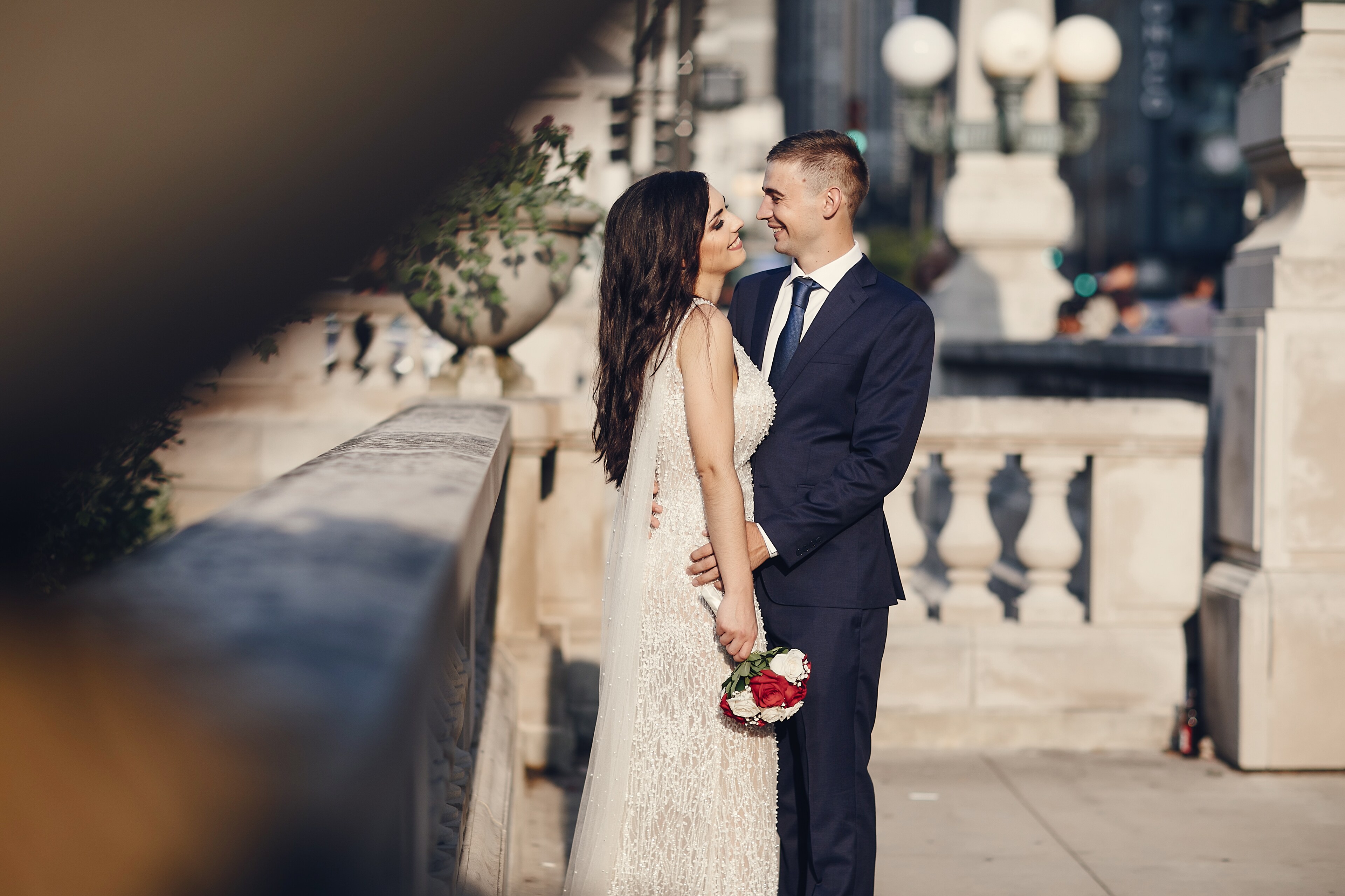 A bride and groom share a romantic moment outside ACME Hotel in Chicago.