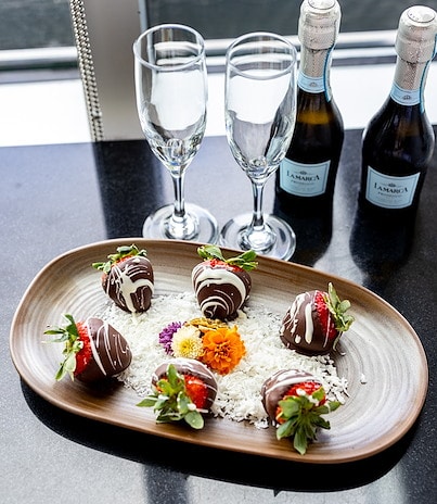 Plate of chocolate-covered strawberries with decorative flowers at Lakeway Resort & Spa, Texas