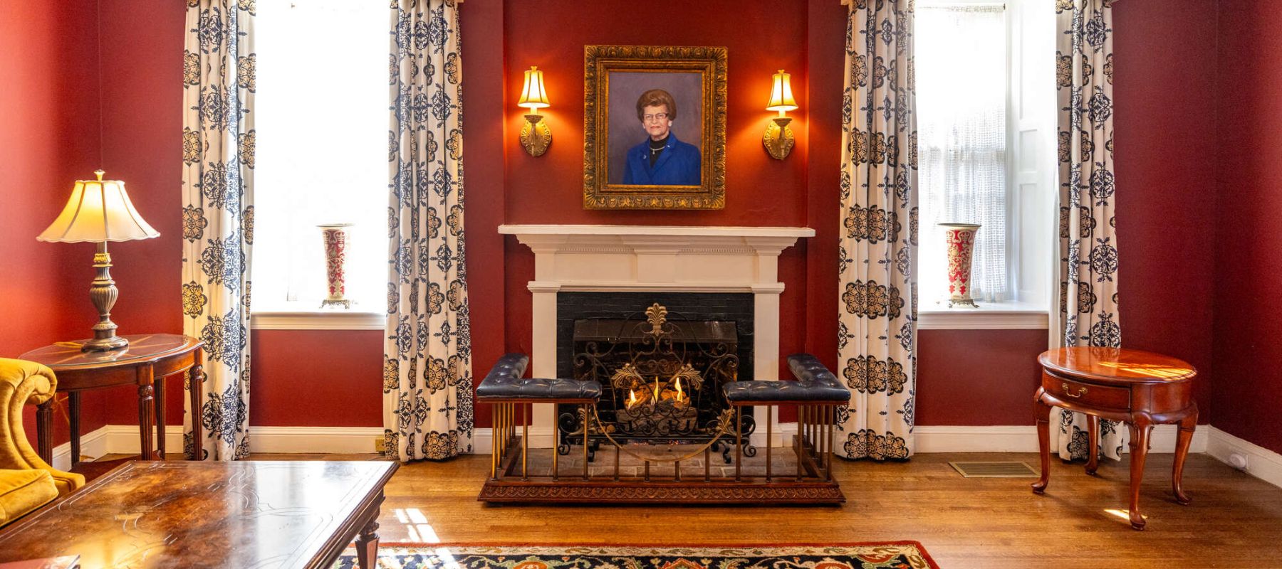 Portrait of Ms Peg hanging over fireplace