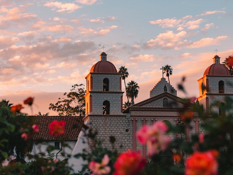 mission at sunset with roses