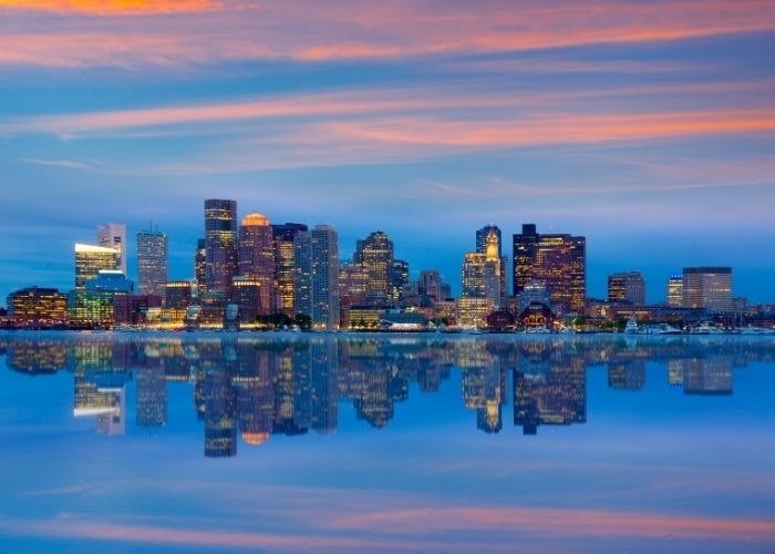 A city skyline with a body of water