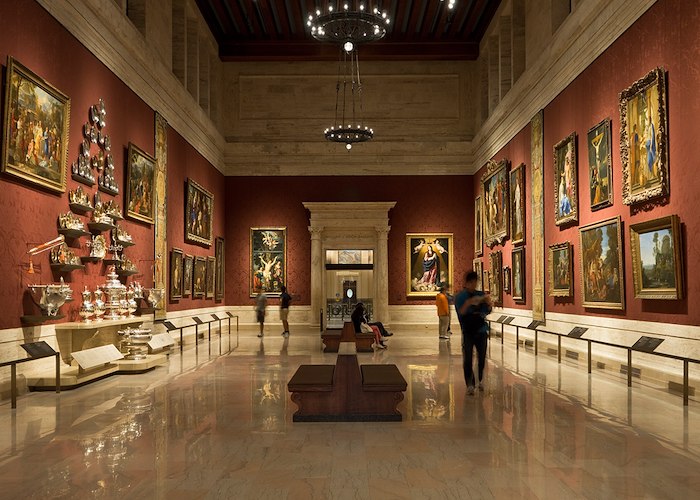 A museum with many paintings on the walls