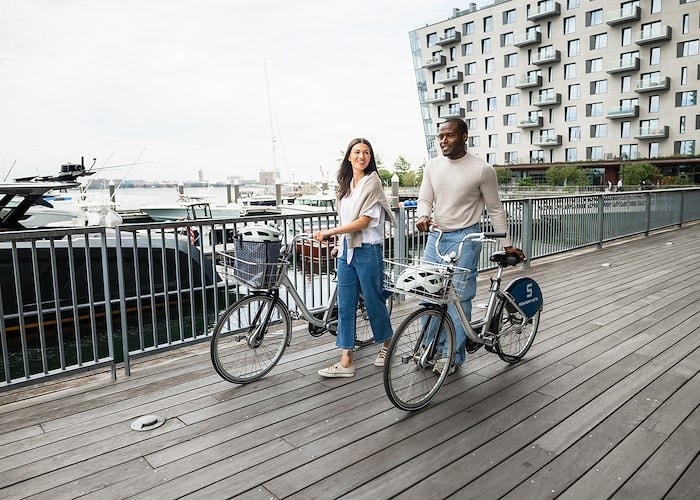 A man and woman on a bicycle