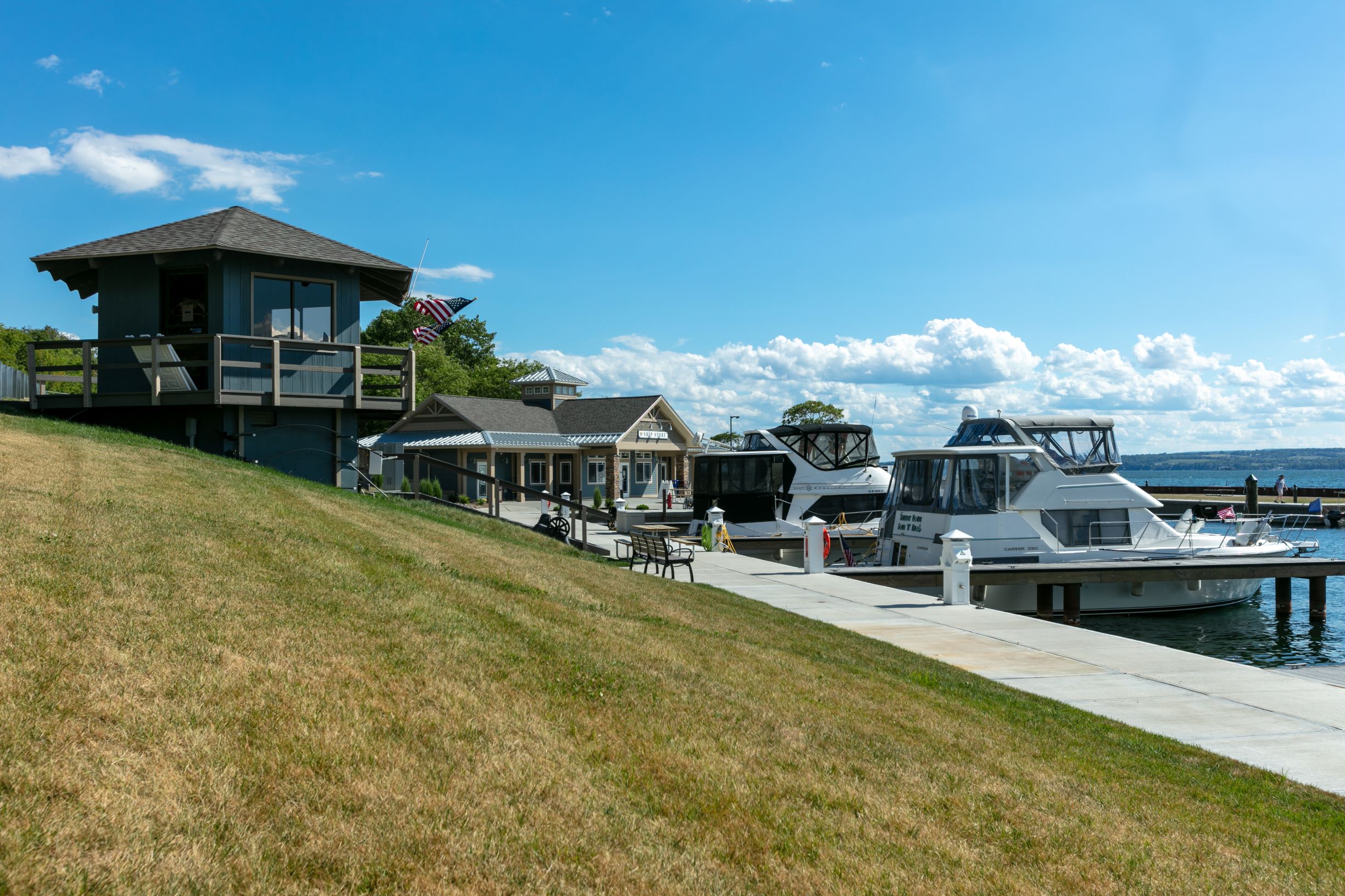 Seneca Lake Resorts features a serene waterfront and docked boats.
