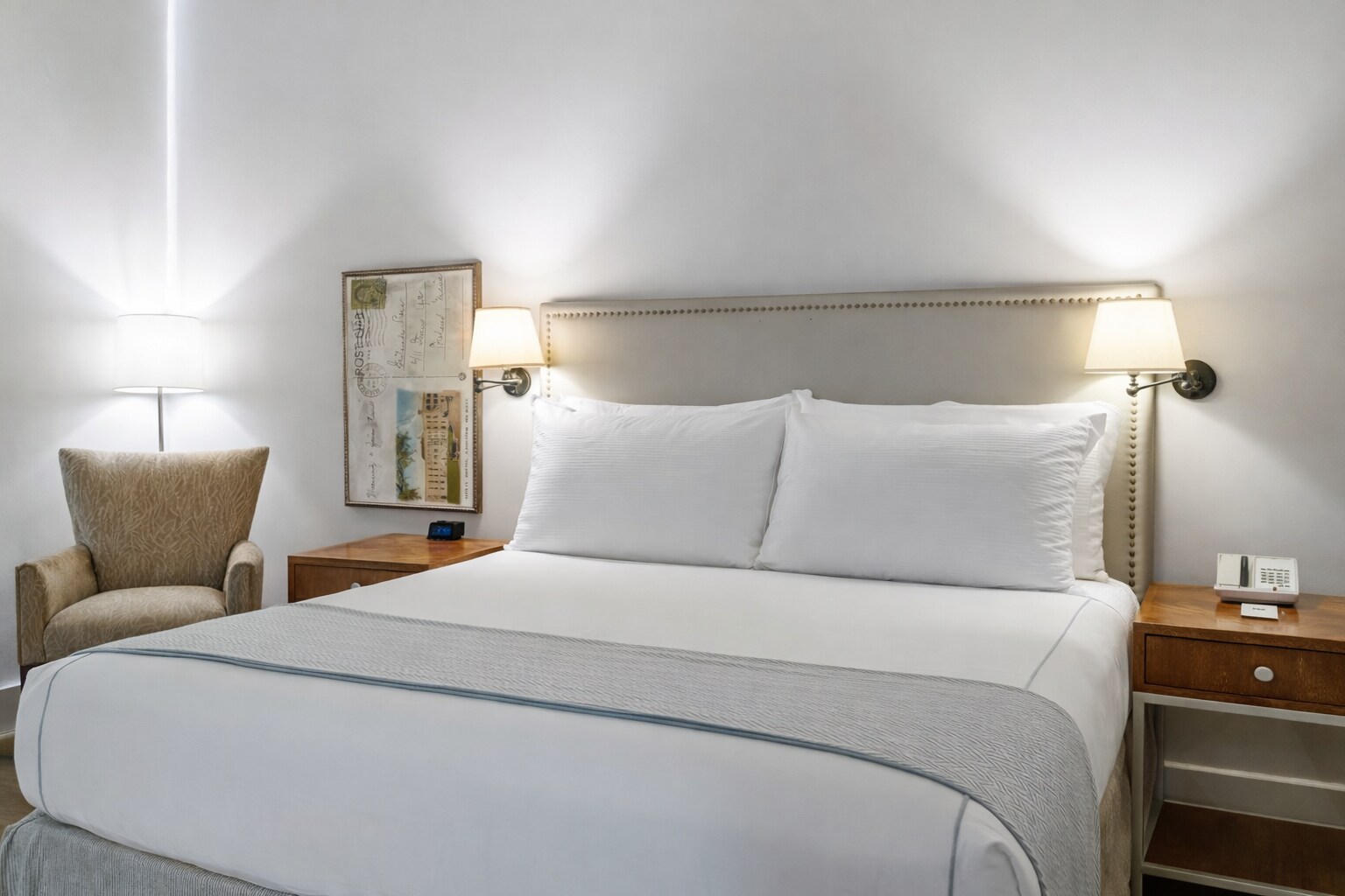 A hotel room with a bed, chair and lamp, Hotel Parq Central, Albuquerque, New Mexico