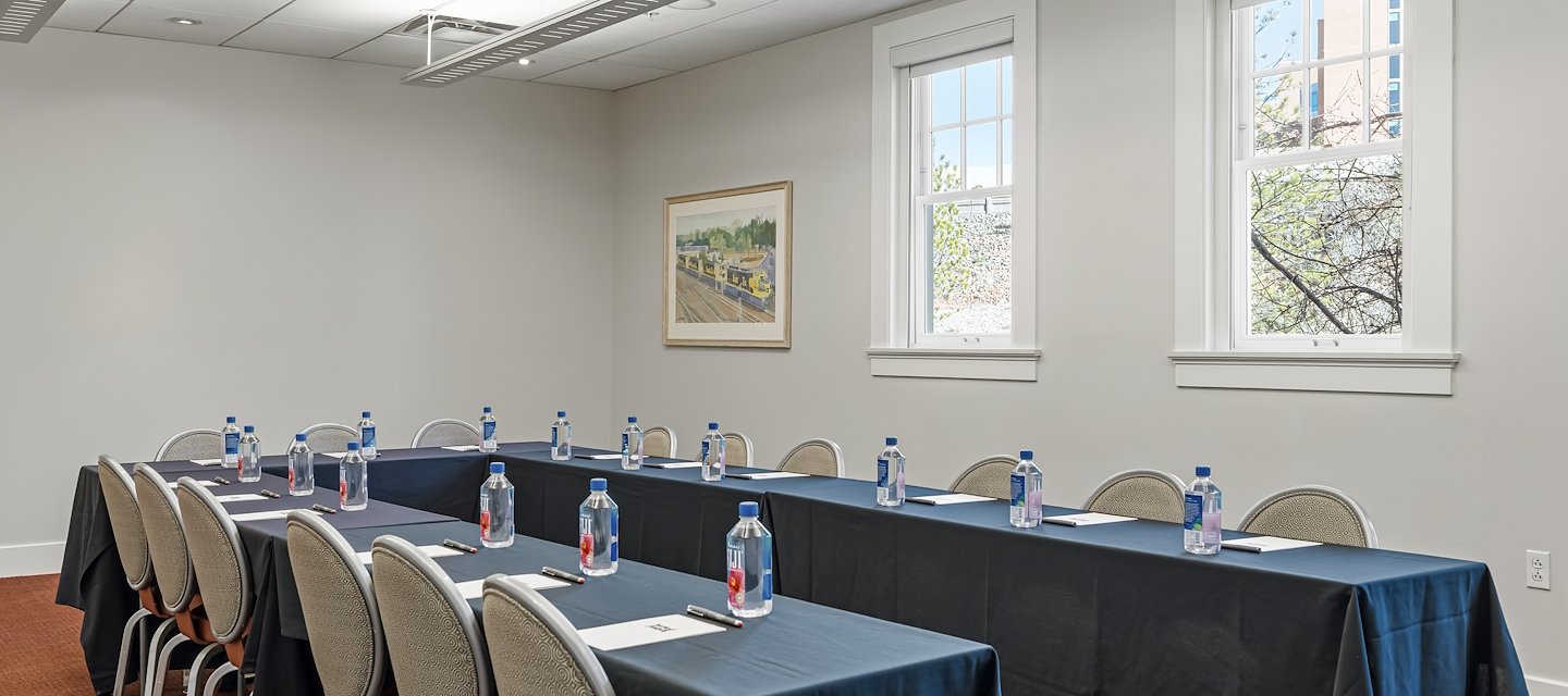 A conference room with tables and chairs set up for a meeting, Hotel Parq Central, Albuquerque, New Mexico