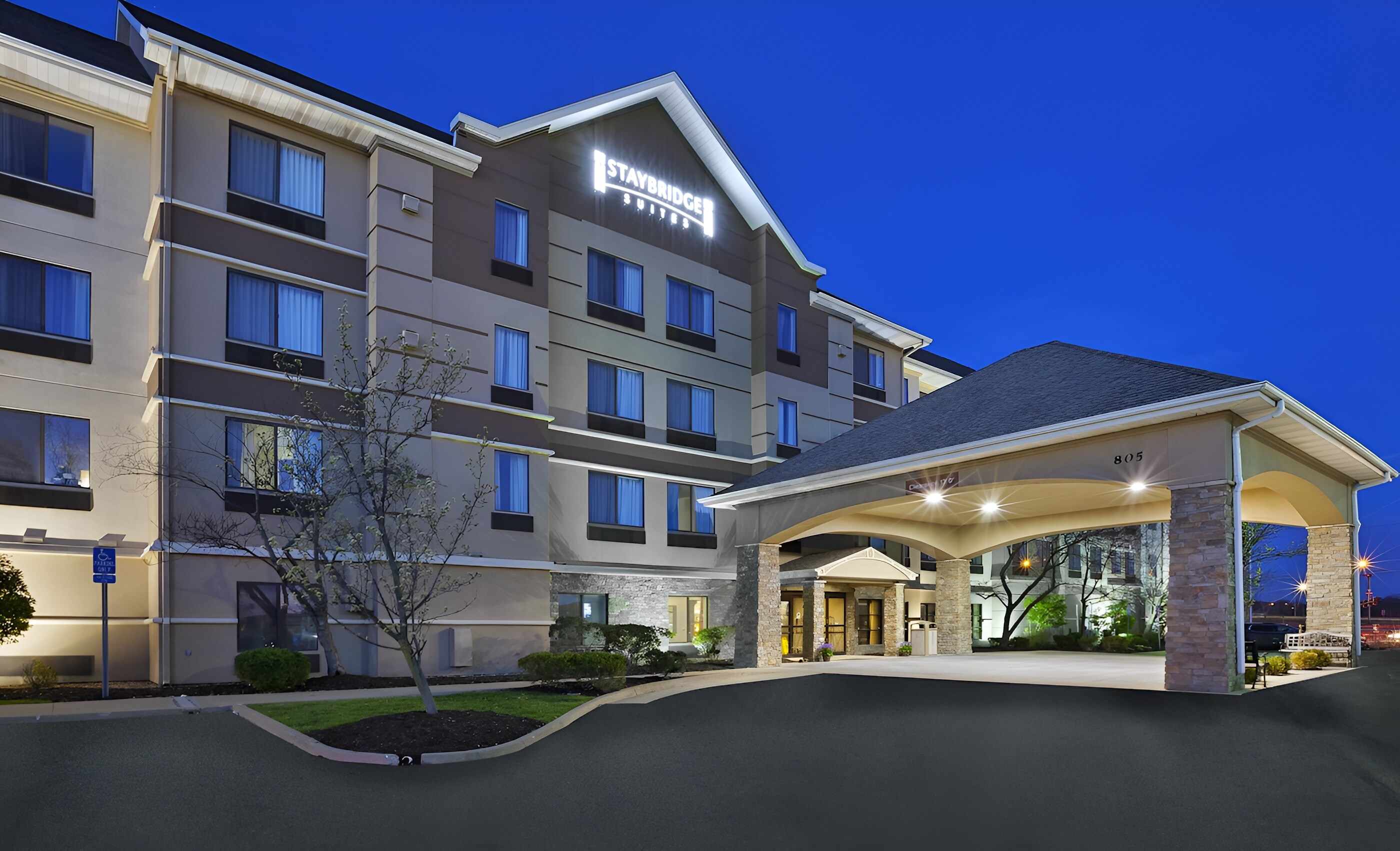 Staybridge Suites Columbia features a welcoming entrance at dusk.