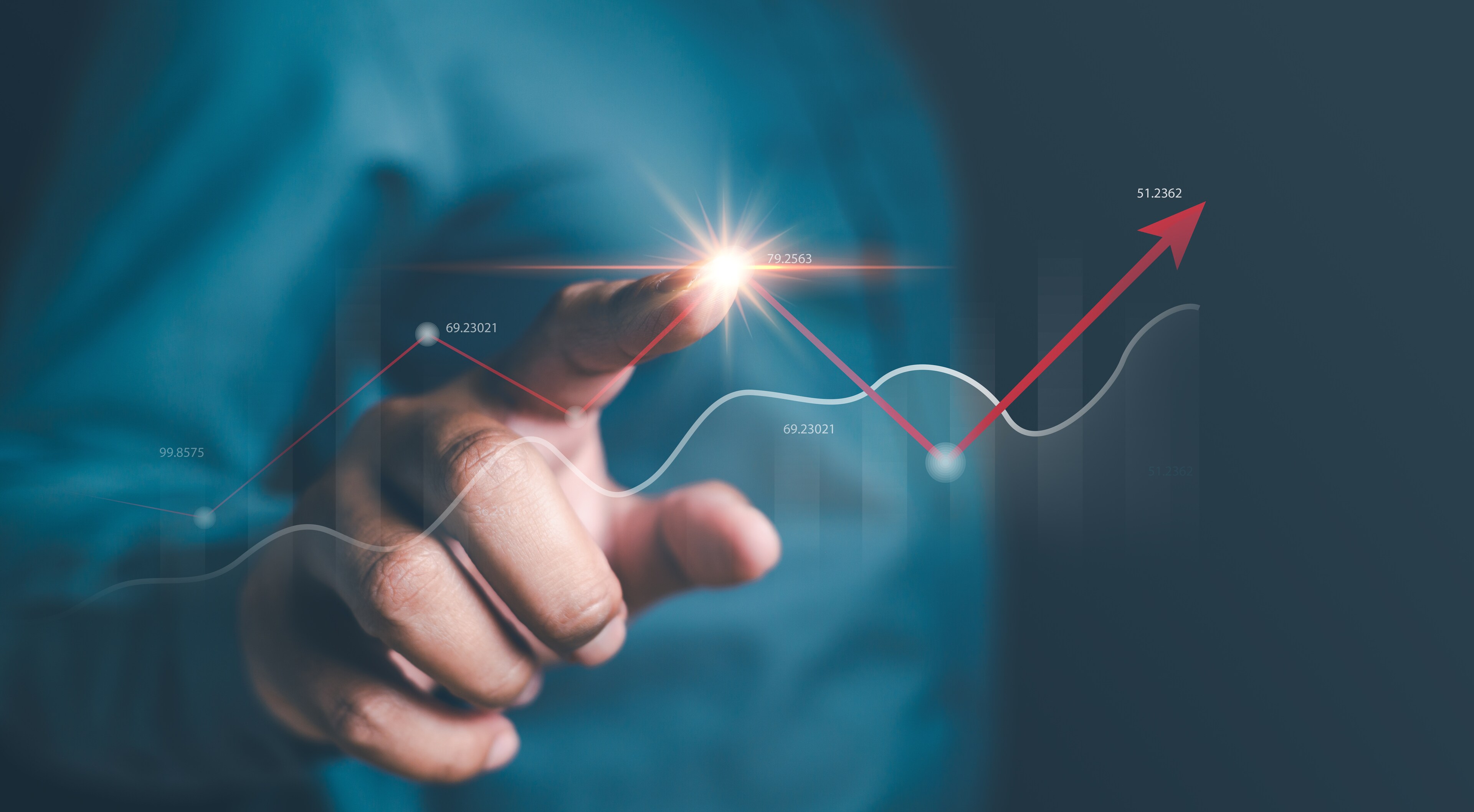A person pointing at a graph with an upward arrow