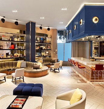 The hotel lobby is decorated with blue and yellow, Stonebridge Companies, Denver, Colorado