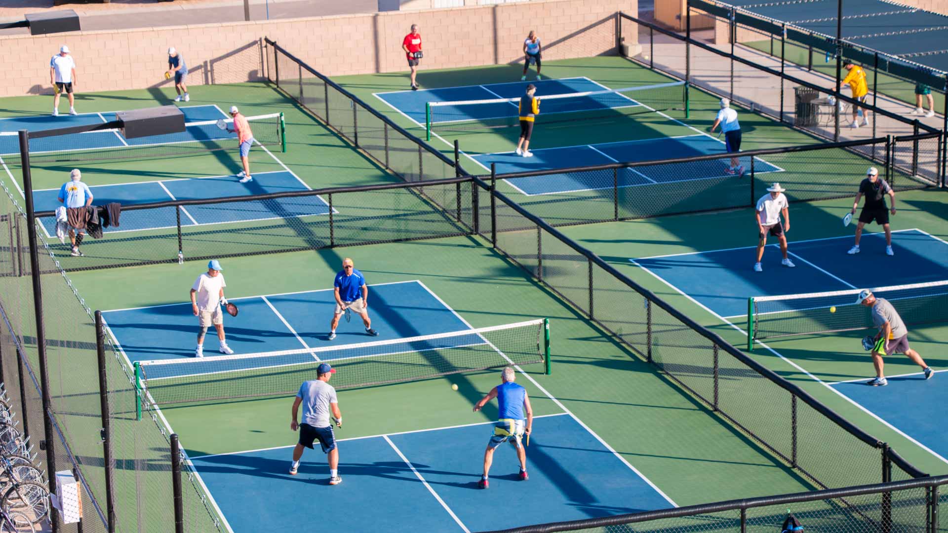 A group of men playing tennis