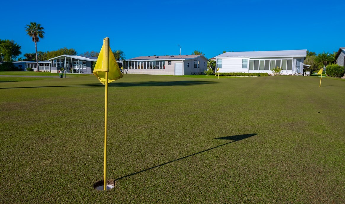 Golf course hole with yellow flag